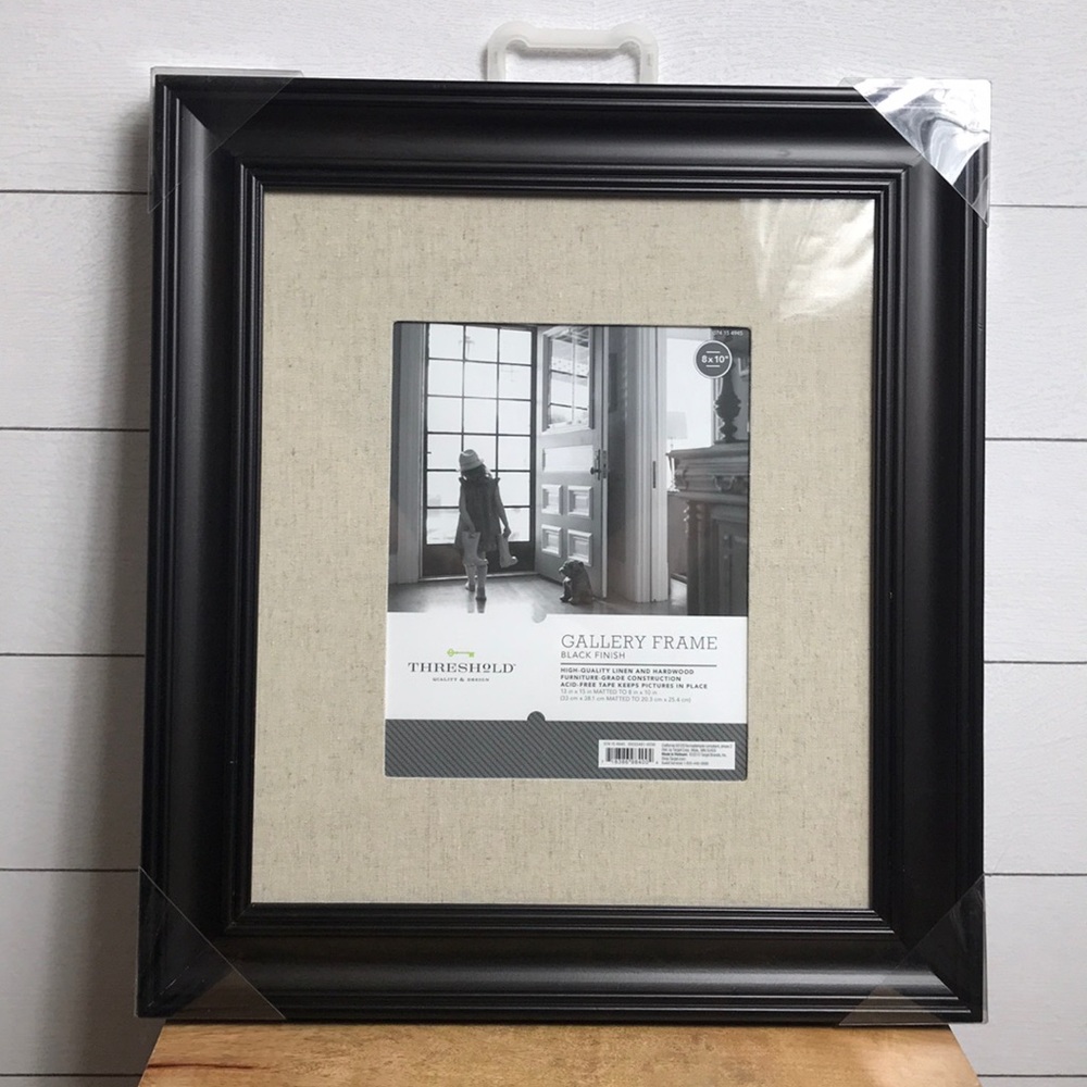 8x10” brown faux wood frame with linen mat.